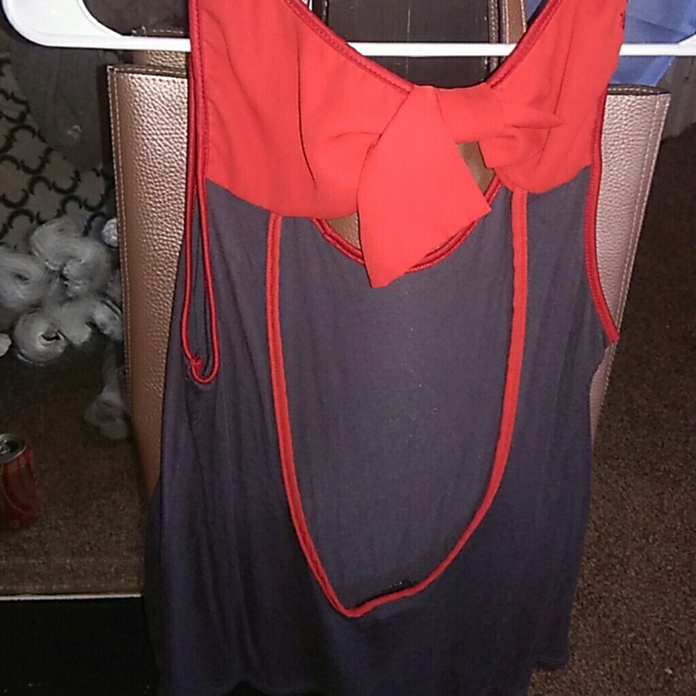 Red/grey sleeveless shirt with bow on back